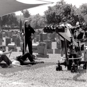 Cemetery scene On location in Los Angeles David Mitchell Carl Thibault lying on wifes grave Cinematographer Maximo Munzi checking light