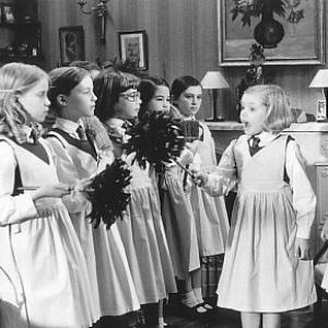 Madeline Hatty Jones second from right and faithful helper Aggie Clare Thomas far right instruct their schoolmates in the fine art of housecleaning