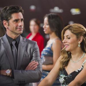 Still of John Stamos and Callie Thorne in Necessary Roughness 2011