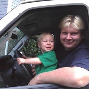 Kai Thorup with visiting son, Dax, in location van.