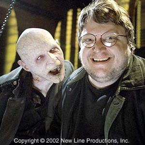 Director Guillermo del toro (right) with a Reaper on the set of New Line Cinema's action thriller, BLADE II.