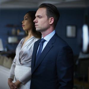 Still of Gina Torres and Patrick J Adams in Suits 2011