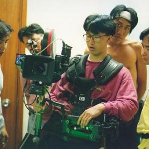 Crew listening to director Tsui in 