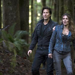 Still of Henry Ian Cusick and Paige Turco in The 100 2014