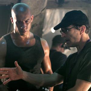 Still of Vin Diesel and David Twohy in Rydiko kronikos (2004)