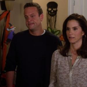 Still of Jami Gertz and Lenny Venito in The Neighbors (2012)