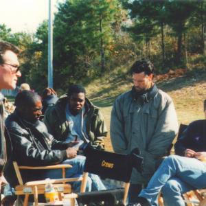 Patrick Swayze director Kevin Hooks Gabriel Casseus Randy Travis and Brian Vincent Kelly rehearse before shooting Black Dog