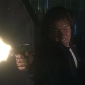 Still of Craig Vincent shooting it out with Robert Davi in HITTERS 2002