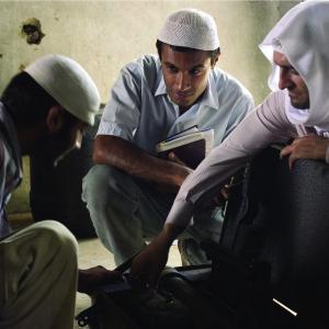 Still of Amr Waked Sonnell Dadral and Mazhar Munir in Syriana 2005