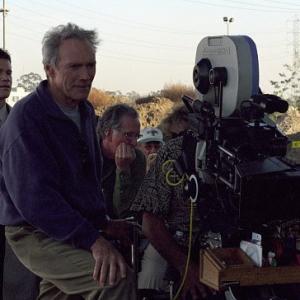 DYLAN WALSH left looks on as director and star CLINT EASTWOOD sets up a shot for Malpaso Productions suspense thriller Blood Work distributed by Warner Bros Pictures