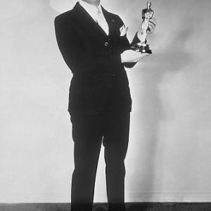 Jack Warner with a special Academy Award given to Warner Brothers for producing The Jazz Singer considered the pioneer outstanding talking picture which revolutionized the industry  May 16 1929