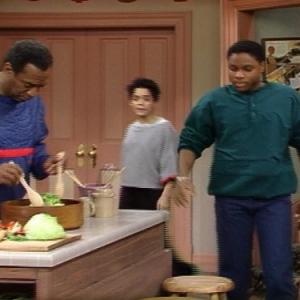 Still of Bill Cosby and MalcolmJamal Warner in The Cosby Show 1984