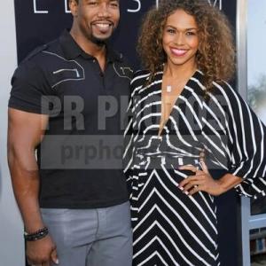 Michael Jai White and fiancée Gillian Waters at the premiere of Elysium in Westwood, CA.