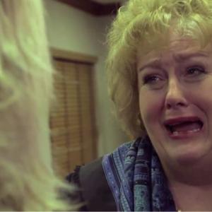 Tracy Weisert crying in a production still from my screen sons funeral in FIRSTS THE SERIES