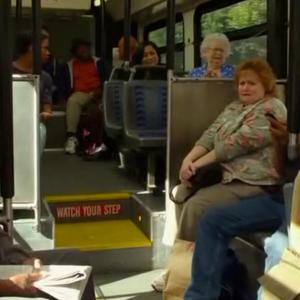 A still of Tracy Weisert on the bus in THE MUPPETS as Walter screams