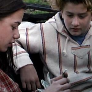 Katie (Megan Wilson) and Beaucoup Brad (Max Kasch) count the stolen money