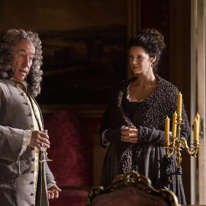 Still of Simon Callow and Caitriona Balfe in Outlander (2014)