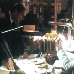 Bud White (Russell Crowe) and Ray Pinker (Gene Wolande) uncover important evidence in L.A. CONFIDENTIAL.