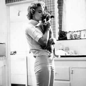 Joanne Woodward with her pet dog at home in Beverly Hills, CA, 1958.