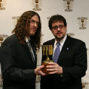 Weird Al Yankovic presents the award for feature music to Michael Giacchino