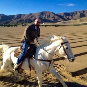 James Zahnd on set riding horses