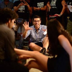 Joe Menendez lining up and laughing with a shot on the set of Quiero Ser Fiel in 2013