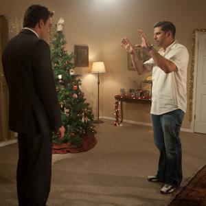 Joe Menendez lines up a shot with KC Clyde on the set of 3 Holiday Tails in 2011