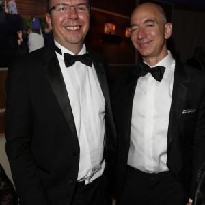Col Needham and Jeff Bezos attend the 2014 Vanity Fair Oscar Party Hosted By Graydon Carter on March 2 2014 in West Hollywood California