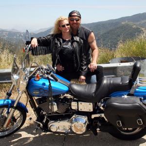 Michael Gier with his wife Terri and his Harley Davidson