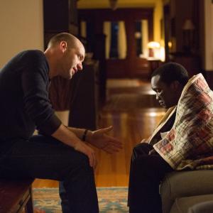 Still of Arnold Oceng and Corey Stoll in The Good Lie (2014)