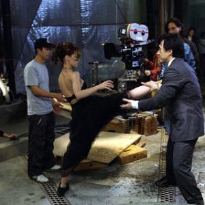 JENNIFER LOVE HEWITT center left gets some help from JACKIE CHAN center right on one of her highkicking moves as director KEVIN DONOVAN rear center and star RITCHIE COSTER rear right look on