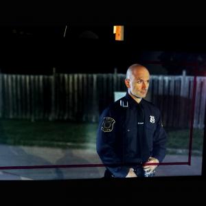 Sebastian MacLean as Officer Medavoy in the feature film Adams Testament