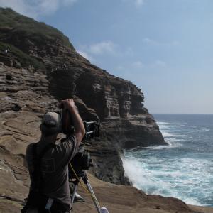 All harnessed up to shoot on a cliff face