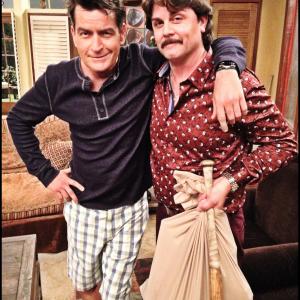 Johnny & Charlie Sheen on the set of Anger Management with Ray's bat & bag of guns.