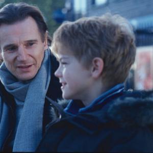 Sam (THOMAS SANGSTER) opens up to his stepfather Daniel (LIAM NEESON) in Richard Curtis' romantic comedy Love Actually.