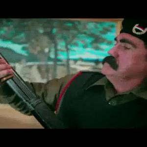 James Evans as Saddam Hussein in the music video 