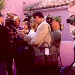 Larry Montz news conference following ISPR field investigation of a Hollywood Hills mansion for Mitzi Shore (The Comedy Store). January 1999