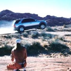 Stunt Coordinator Rich Hopkins foreground on location Valley of Fire Nevada Spot for KIA featuring Andre Agassi  Stunt Driver Gary Laurent