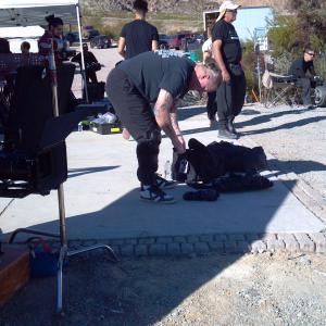 Stunt Coordinator & Driver Rich Hopkins gears up for a car crash for 