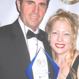Thom Michael Mulligan Producer of the award winning feature film Callous with lead actress Kari Nissena Holding The Best Feature Film Award  Indie Fest USA Film Festival