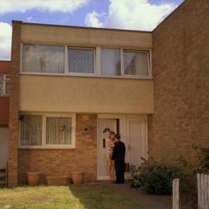 Still of Helen Mutch and Andy Bates in Gardens with Red roses
