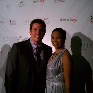 The Kentucky Derby Prelude Party benefiting Blessings in a Backpack standing with Bob Guiney