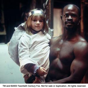 Still of Djimon Hounsou and Emma Bolger in In America (2002)