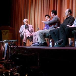 Jeffrey Vance center with film critic Roger Ebert far left Darren Ng second from left and Ken Winokur and Terry Donahue of The Alloy Orchestra far right during a panel discussion at the 6th Annual Ebertfest April 23 2004