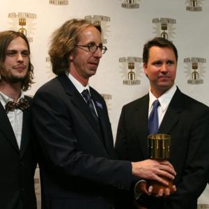 Presenters Jesse McCartney and Matthew Gray Gubler congratulate Best TV Production winners Kit Boss, Kenny Micka and Ben Stout