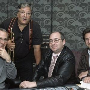 Composer James Newton Howard (left) and Latin jazz legend Arturo Sandoval (center left) collaborated with Sonnenfeld (center right) and producer Tom Jacobson (right).