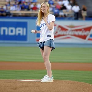 Actress Elle Fanning throws out the ceremonial first pitch before the game between the Chicago White Sox and Los Angeles Dodgers at Dodger Stadium on June 4, 2014 in Los Angeles, California.