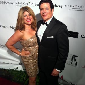WriterDirector Daniel R Chavez with publicist Yvette Morales of YM  Associates on Red Carpet at Children Uniting Nations Oscar after party in Beverly HillsCA