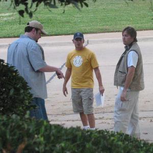 left Producer Bill Lowry middle director Tim Holland II and right writer Brad Thompson V discuss a location shoot on the short film PowerHouse
