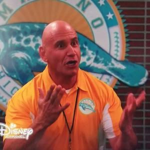 Bruno Amato as Coach Simmons on Austin and Ally 2015